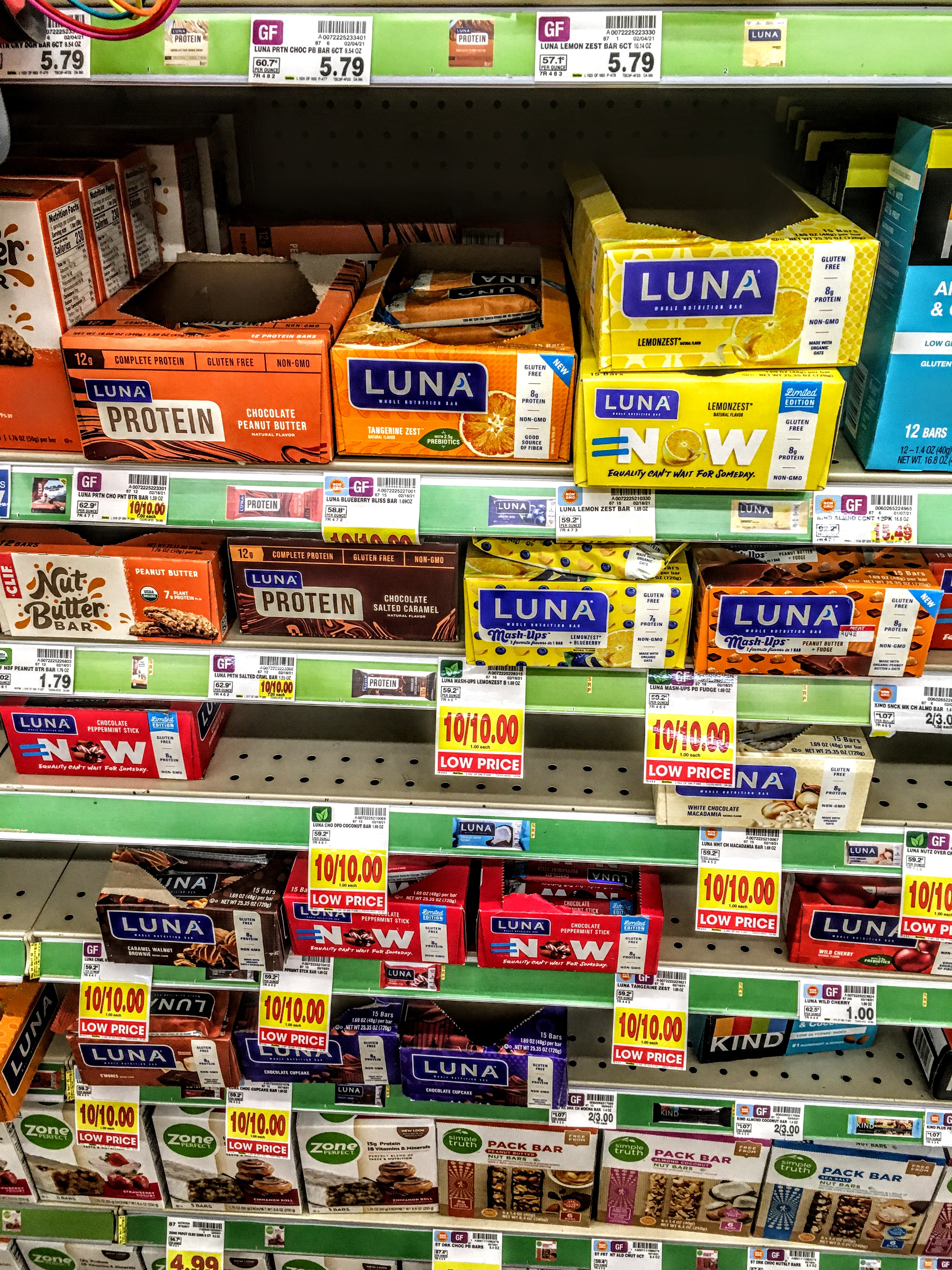 A store shelf displaying luna nutrition bars. 